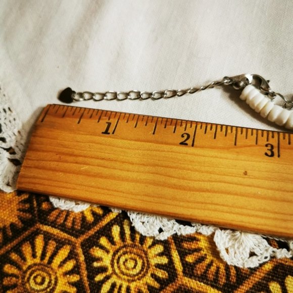 Puka Shell and Plumeria Flower Necklace - Picture 14 of 15